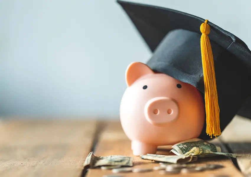 A piggybank with a grad cap