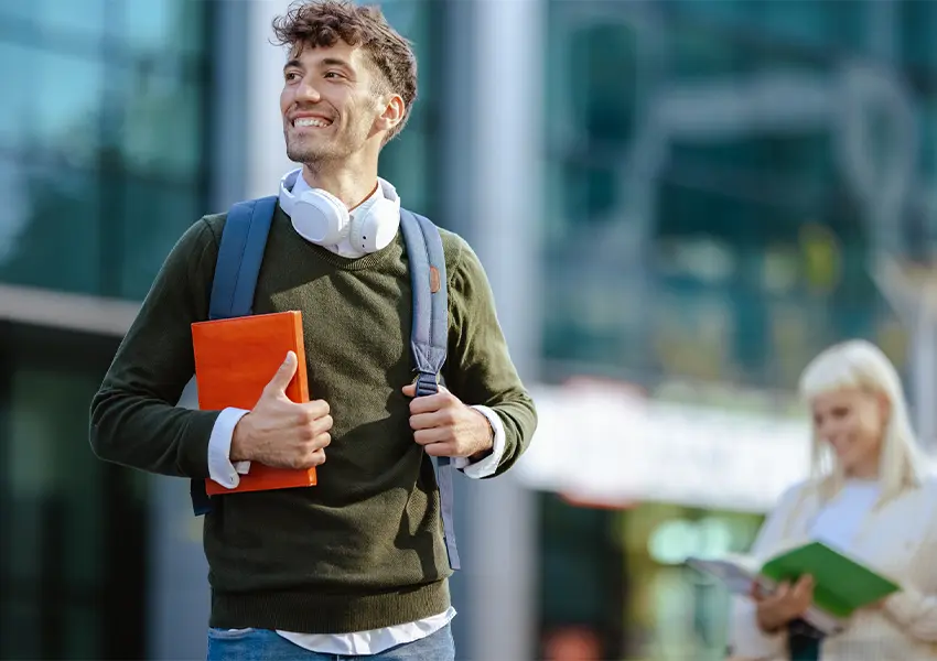 Student smiling with a  backpack on