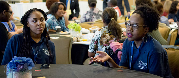 Two female students at the 2018 Student Leadership Conference