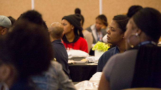 Attendees listening to a speaker