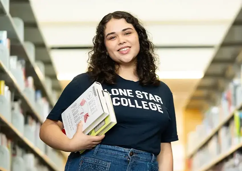 Two smiling students with backpacks