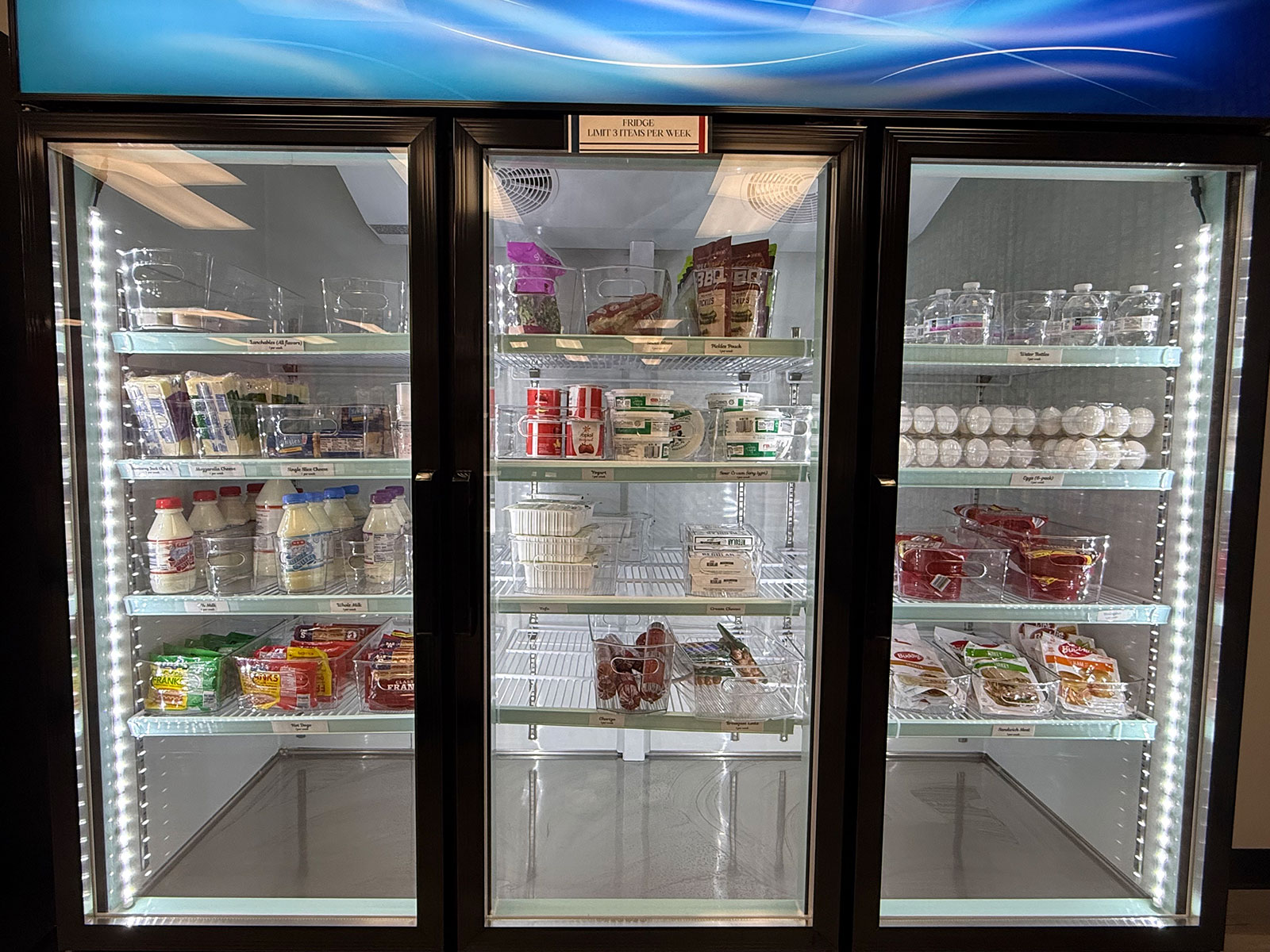 CAT-5 Cupboard Food Pantry cold storage stocked with various refrigerated food items.