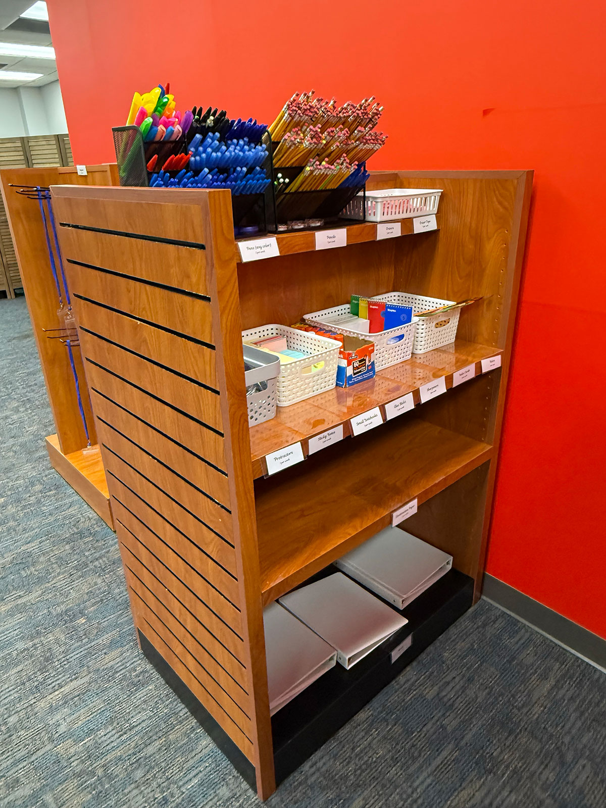 A view of SRC shelving stocked with various school supplies.