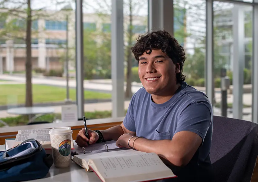 Student working in a textbook