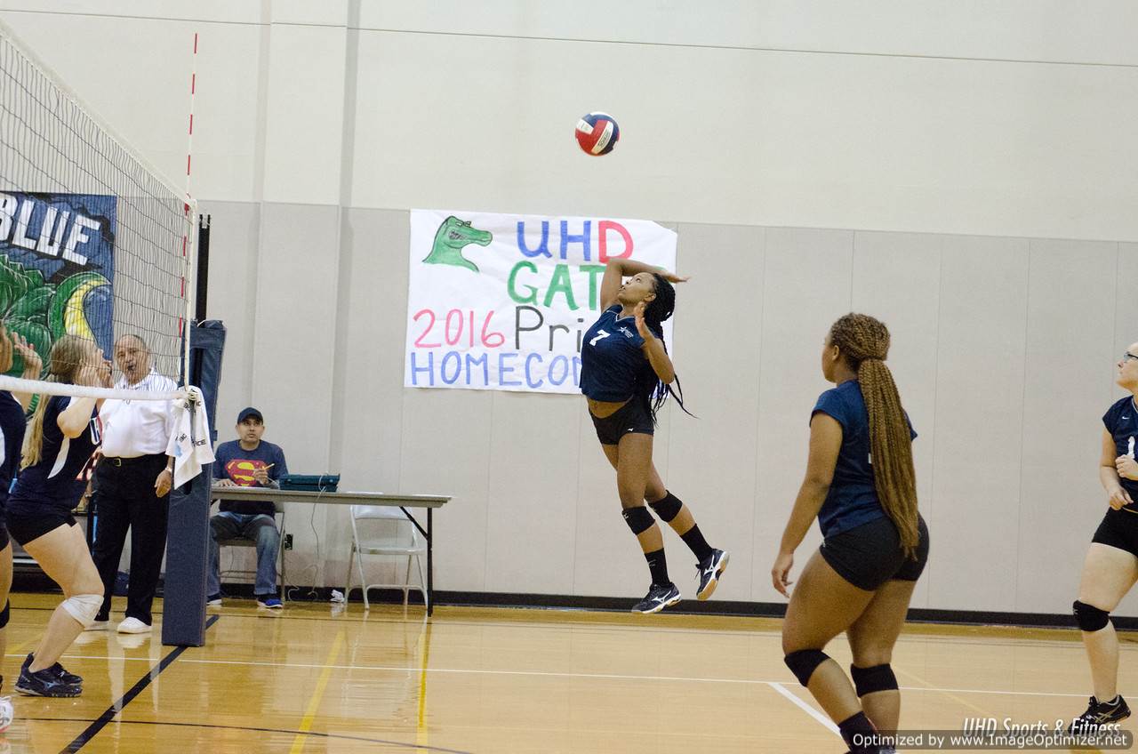 Photo of students from two different teams playing volleyball