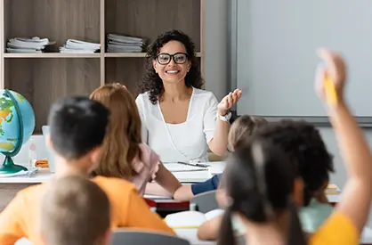 Teacher sitting in front of students