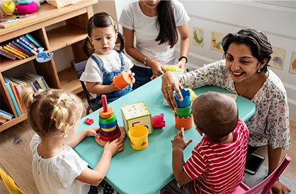 A teacher playing with kids