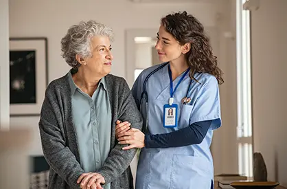 A nurse putting on gloves