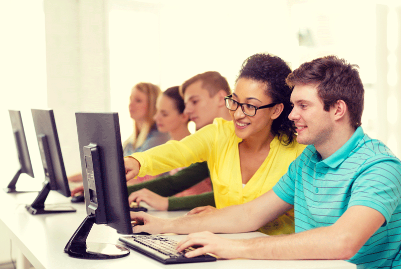 Students sitting at computer