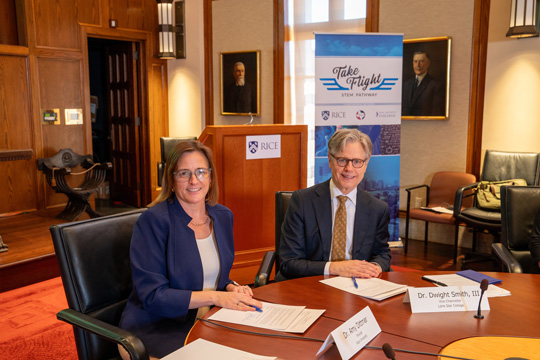 Amy Dittmar, Rice's Howard R. Hughes provost and executive vice president for academic affairs, and Dwight Smith, Lone Star College's vice chancellor for academic and workforce success celebrate the renewal of a memorandum of understanding and signed an articulation agreement to allow transfer students in LSC's Take Flight Program to receive Rice credit for core STEM courses completed at LSC.