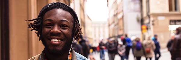 Happy student walking down the street